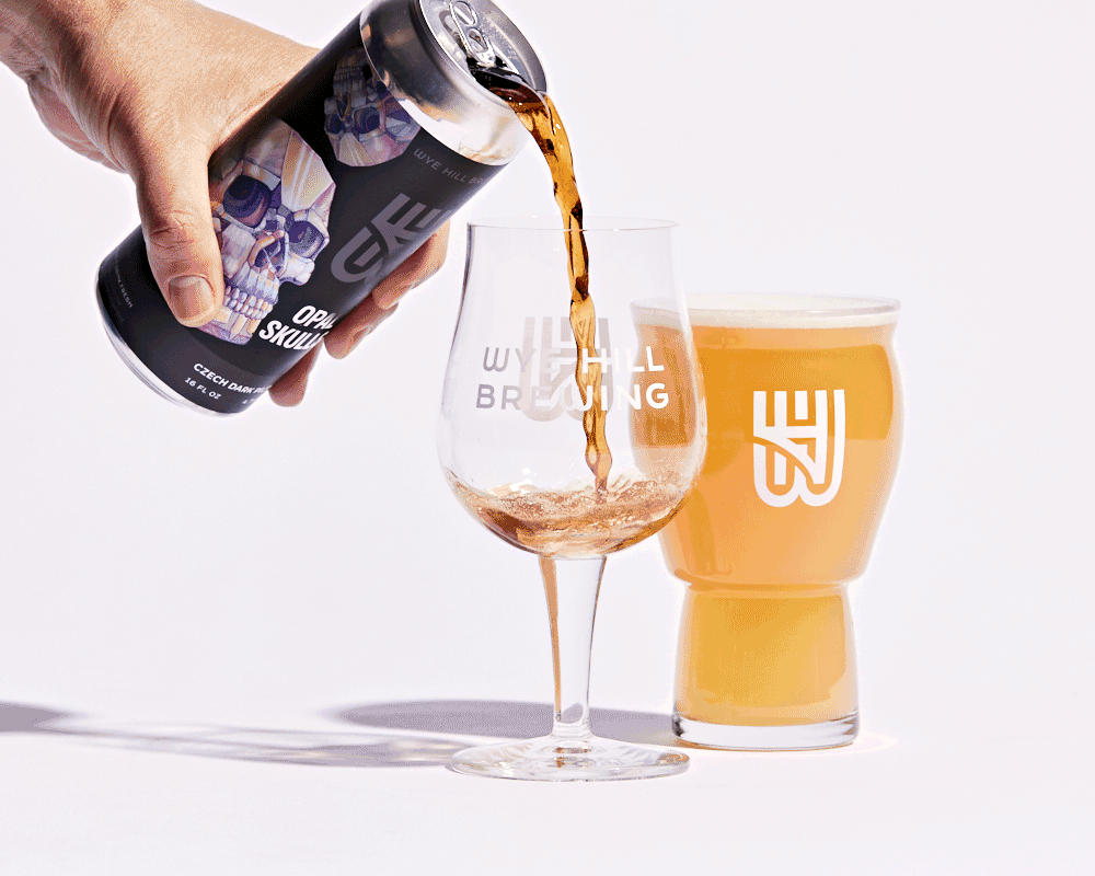 A beer from Wye Hill Brewing in Raleigh, NC getting poured into a pint glass