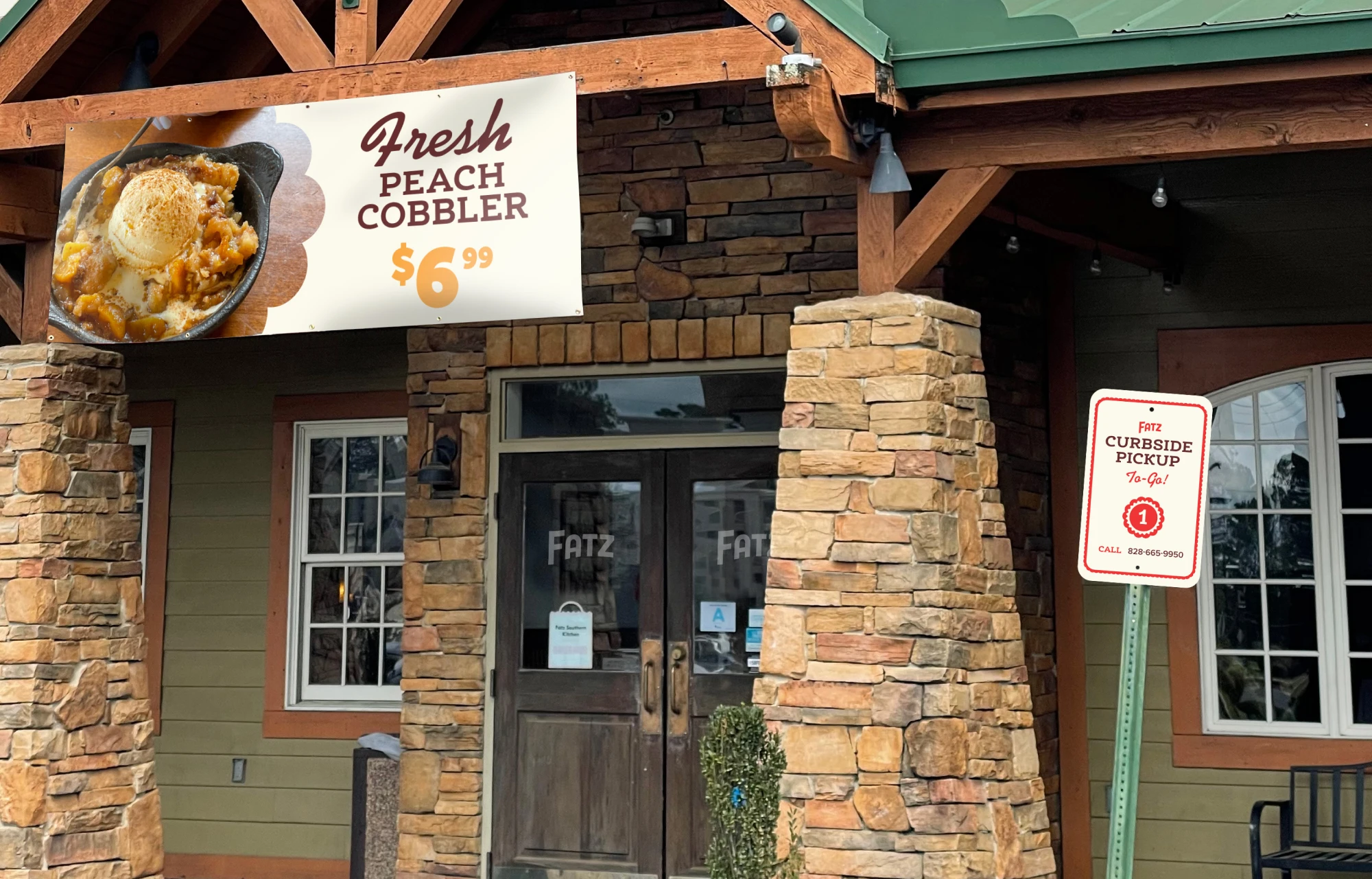 A hanging vinyl banner advertising Fresh peach Cobbler out front of a Fatz Southern Kitchen