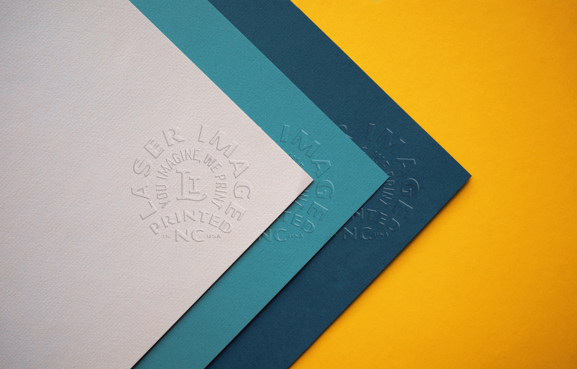 Embossed Laser Image badge logo on three pieces of paper