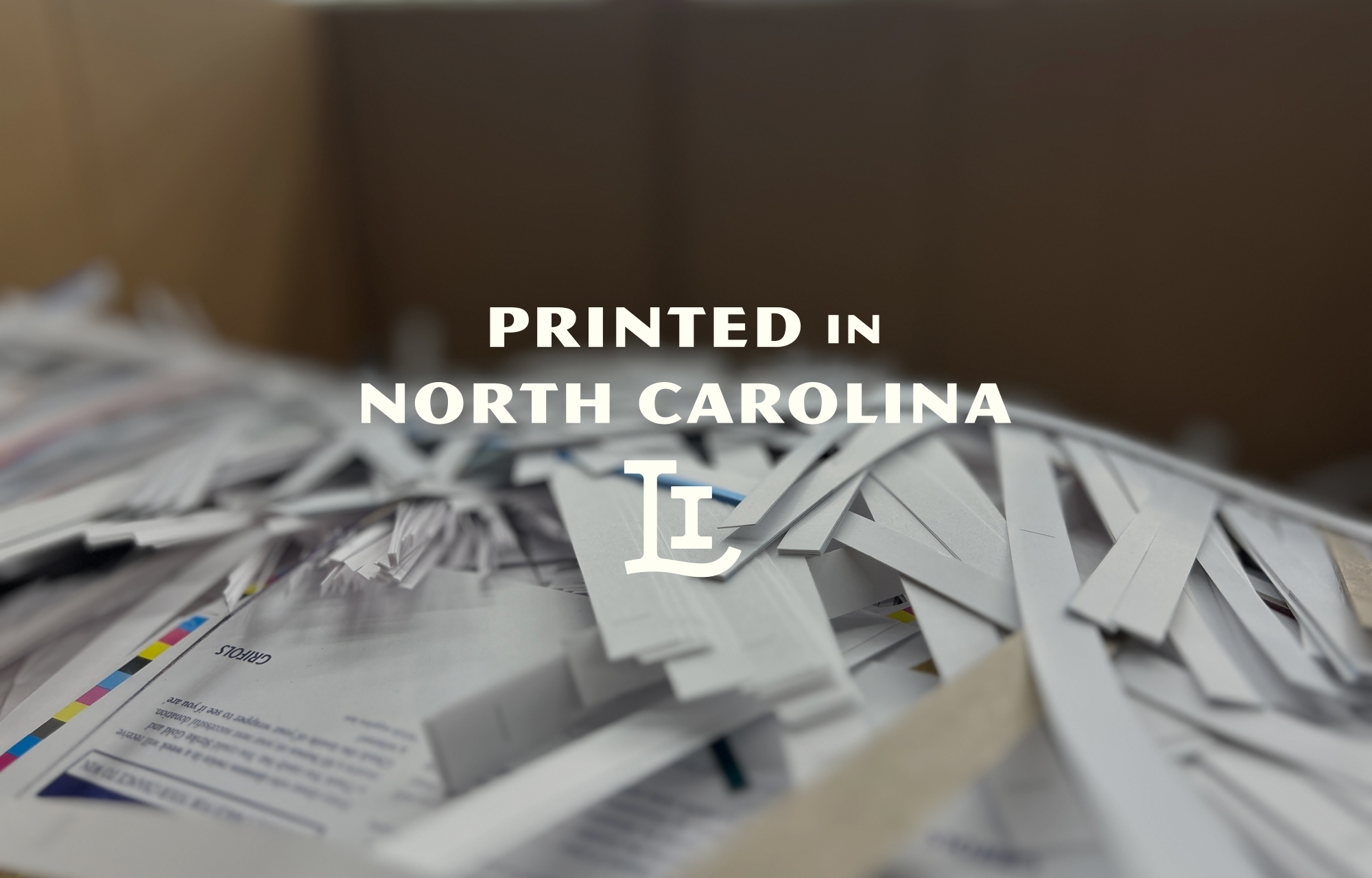 Printed in North Carolina with the Laser Image monogram overlaid on a photo of paper trimmings