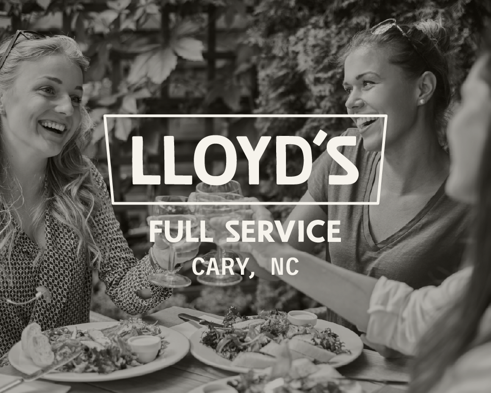 Lloyd's logo over a black and white photo of women enjoying a meal