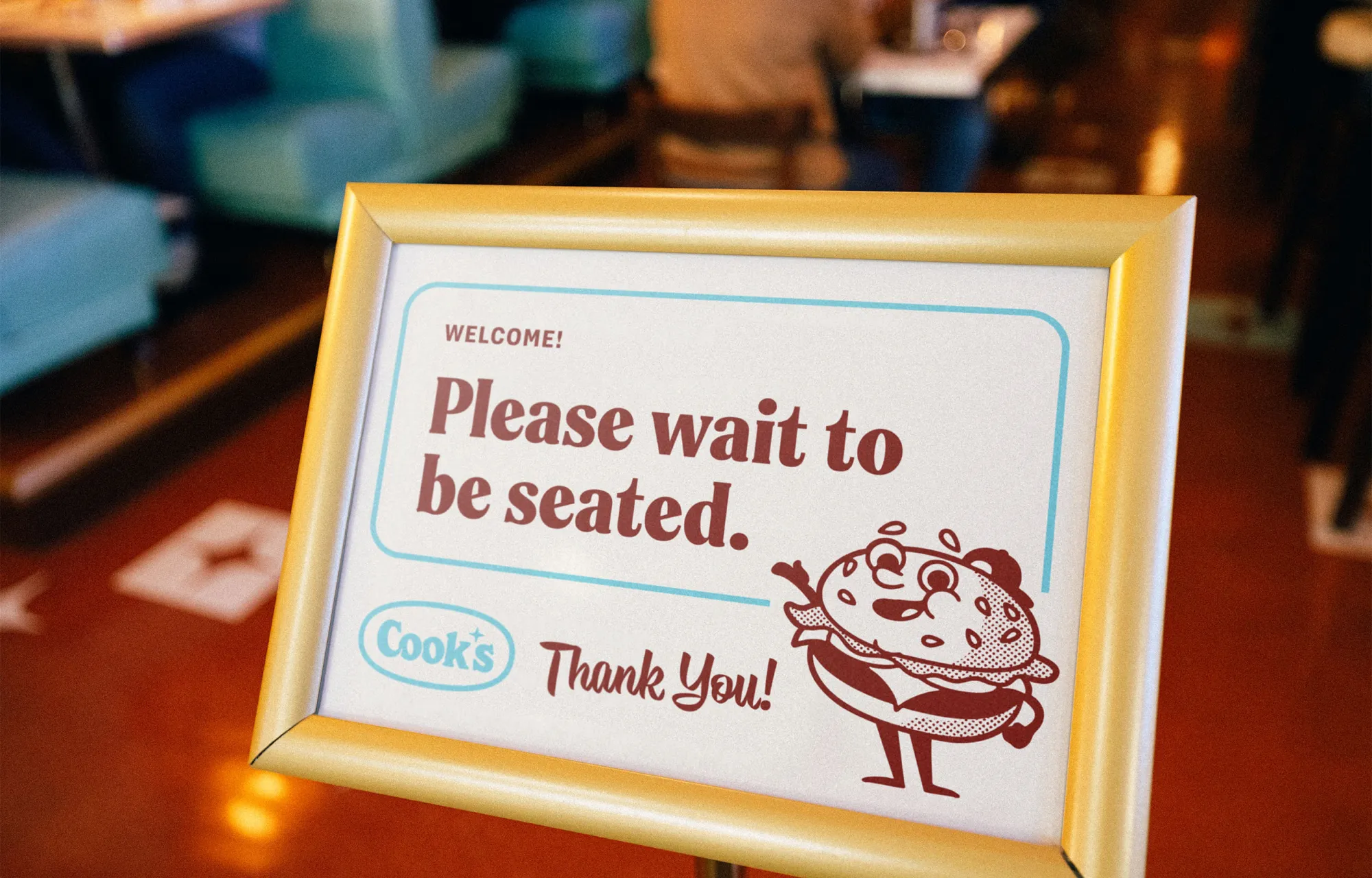 Signage at the host stand to wait to be seated