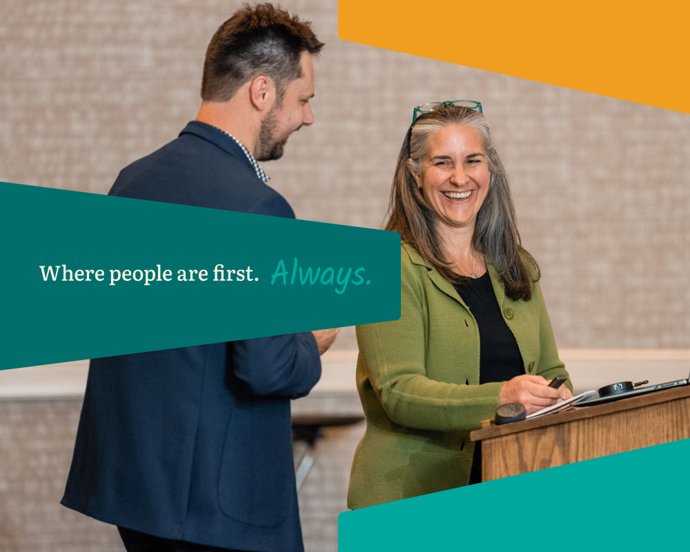A photo of The East Group team members with branded graphics overlaid, including the tagline: Where people are first. Always.