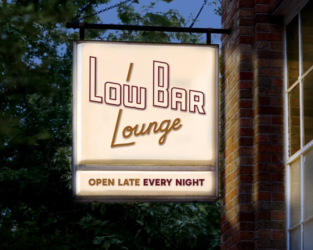 Low Bar Lounge exterior sign, illuminated at night