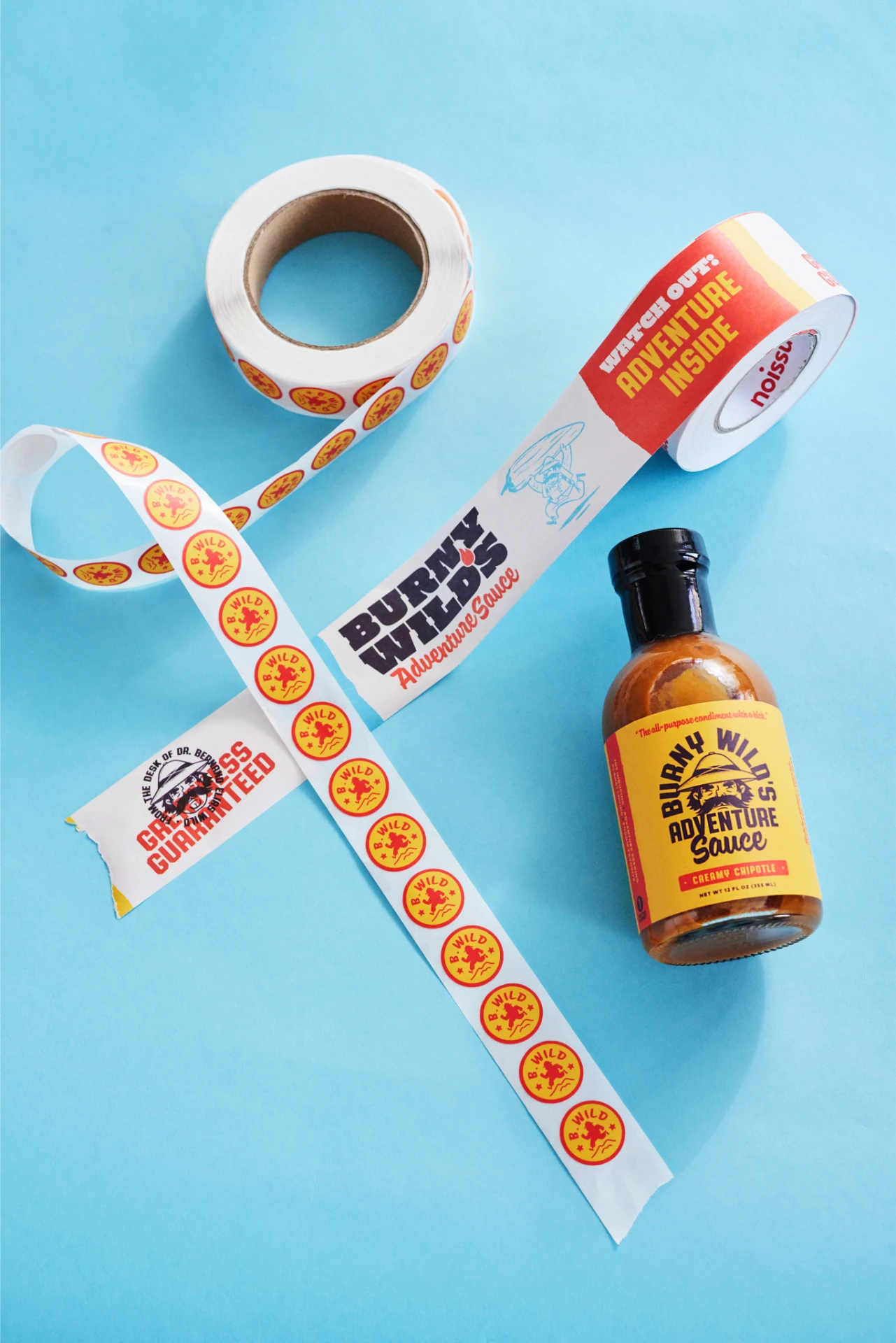 Custom packing tape and round stickers by NoIssue for Burny Wilds