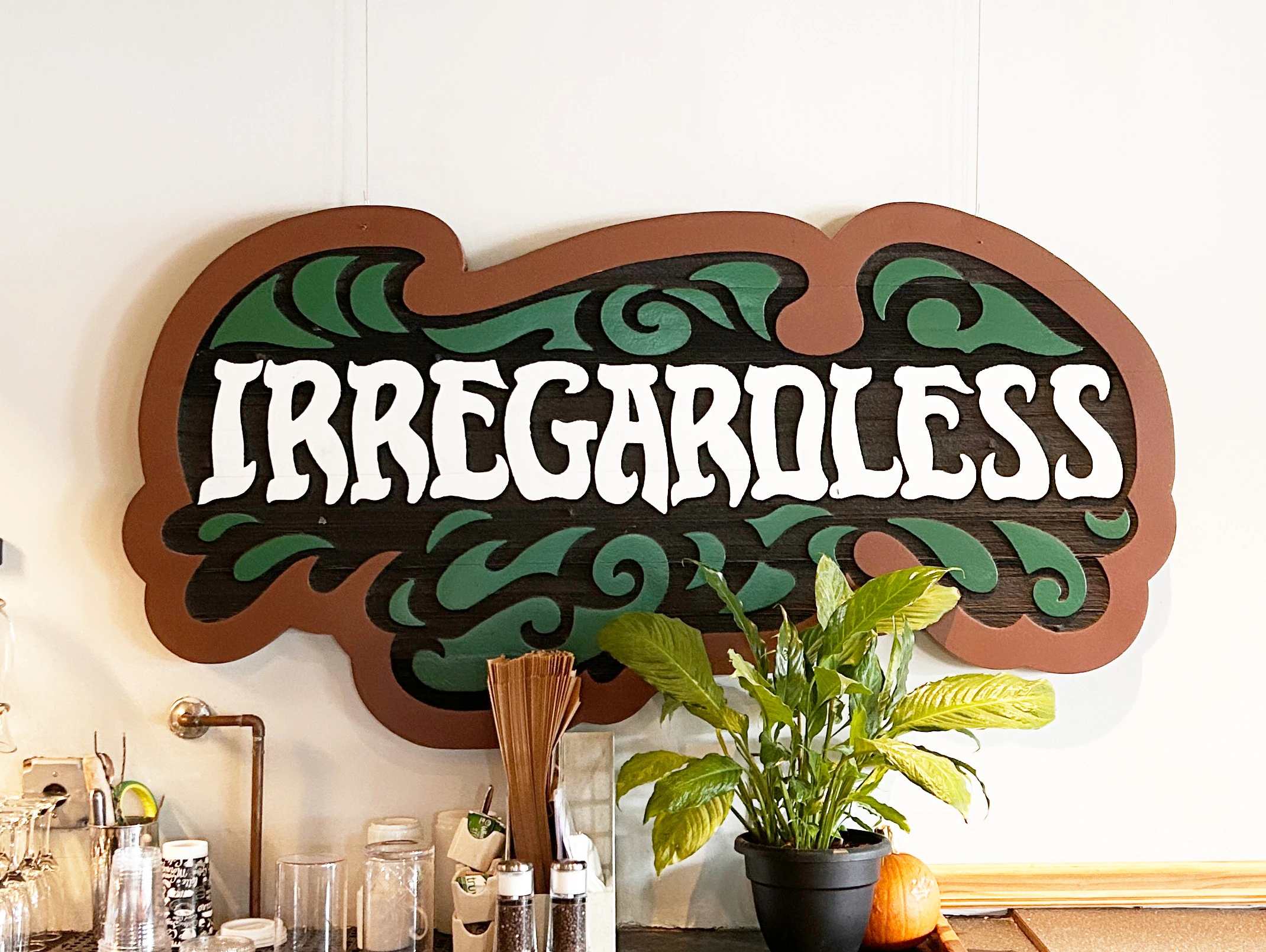 The original wood-carved sign for Irregardless restaurant