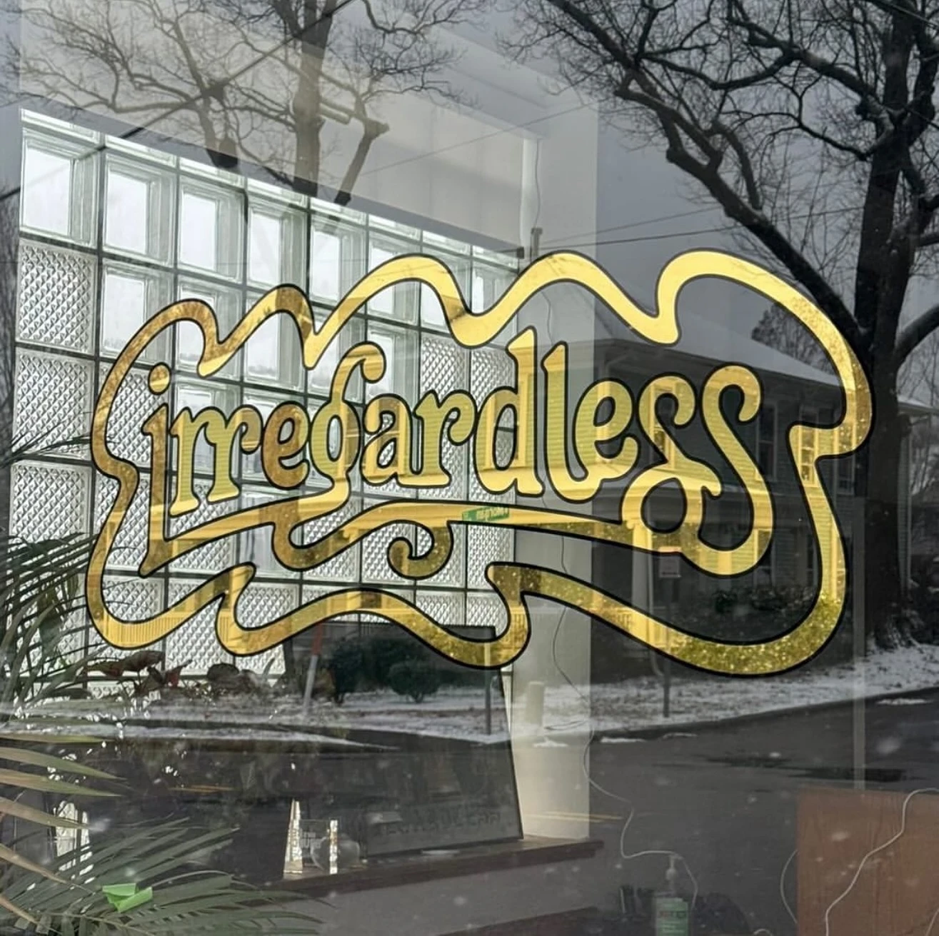 Gold leaf window signage for Irregardless in Raleigh by SPCL Signs