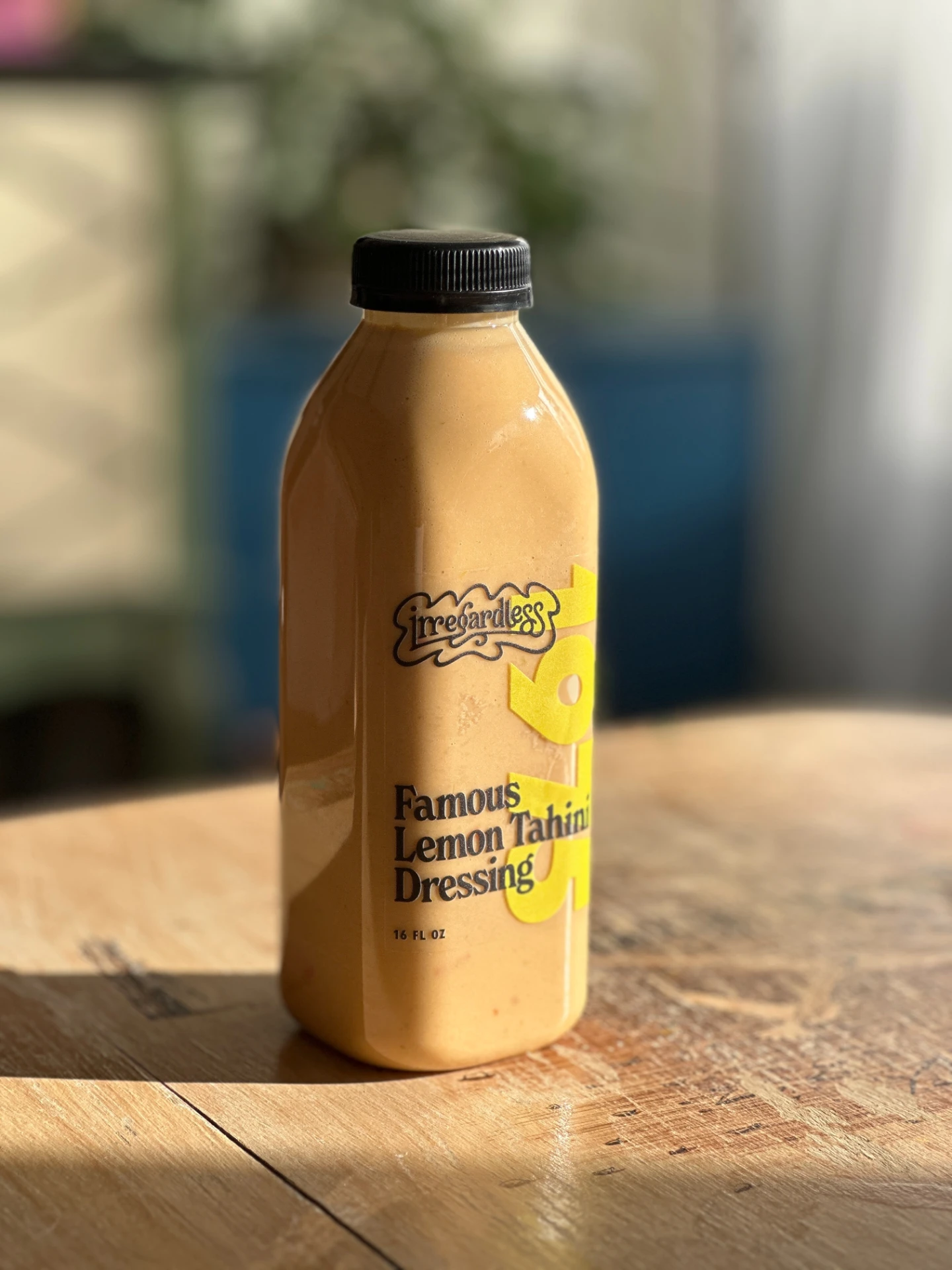 Lemon tahini salad dressing with a custom label for Irregardless