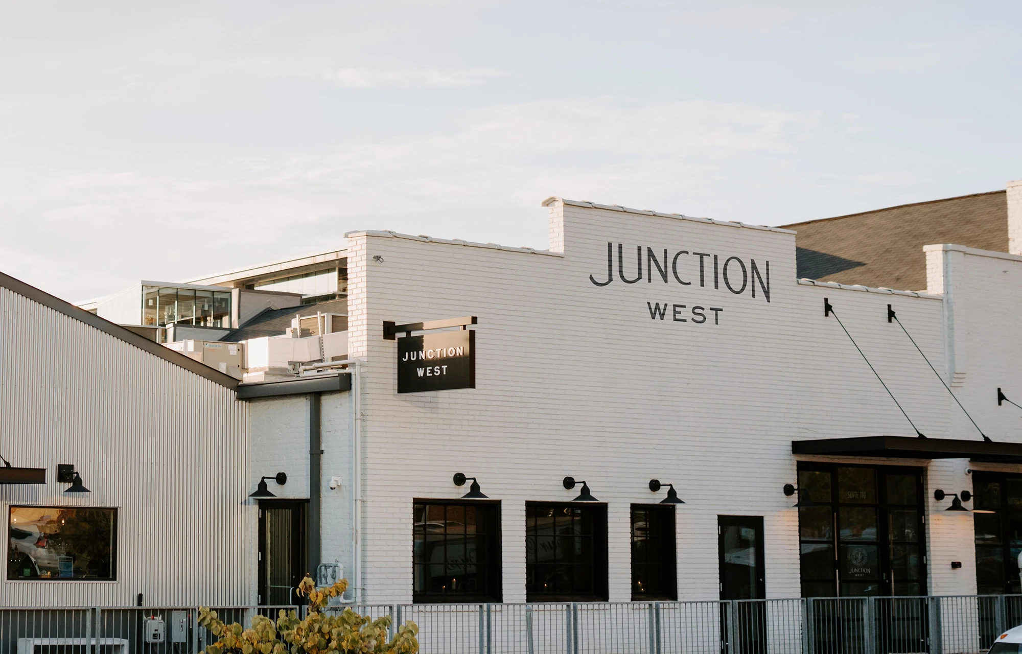A white brick and metal renovated event venue Junction West