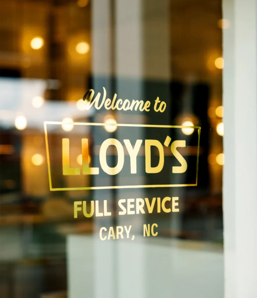 The front door, handpainted in gold leaf, for Lloyd's in downtown Cary