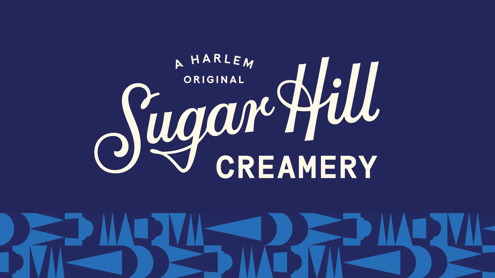 Sugar Hill Creamery logo in vanilla over navy background above a geometric pattern