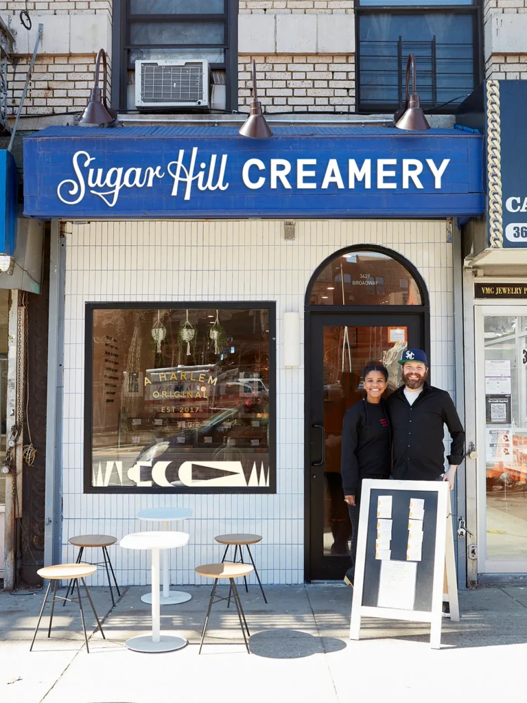 Sugar Hill Creamery storefront with owners standing in the doorway