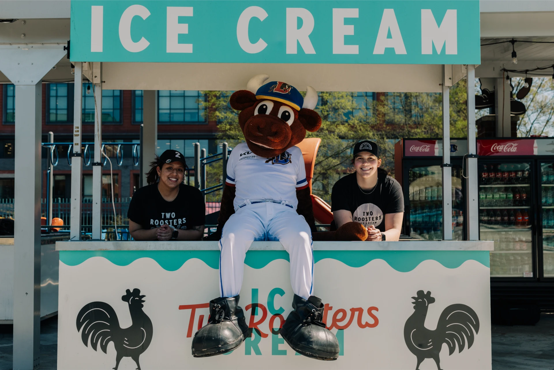 Wool E Bull sitting on the Two Roosters ice cream stand at the baseball stadium