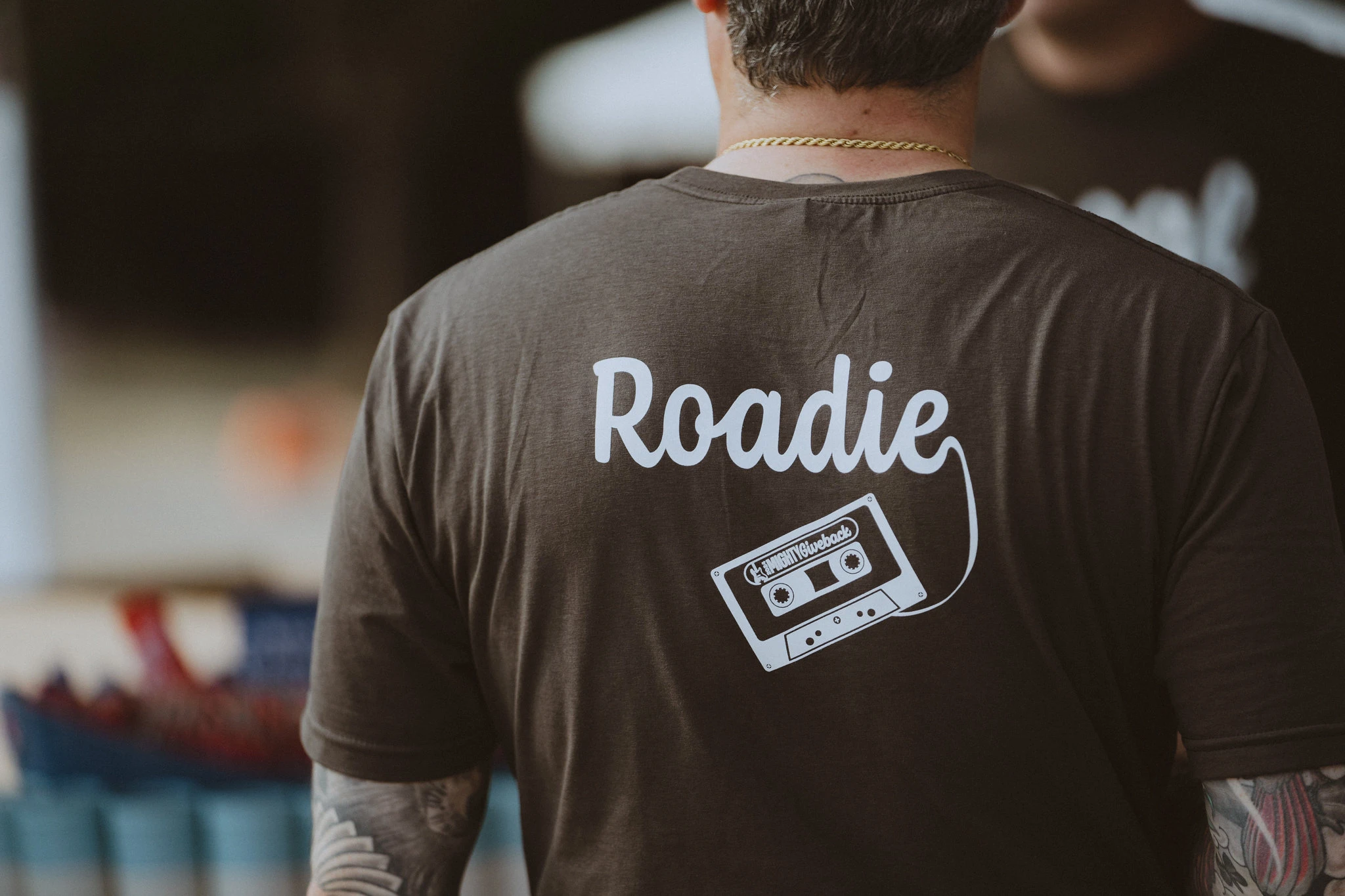 Back of a shirt with 'Roadie' and a cassette tape graphic