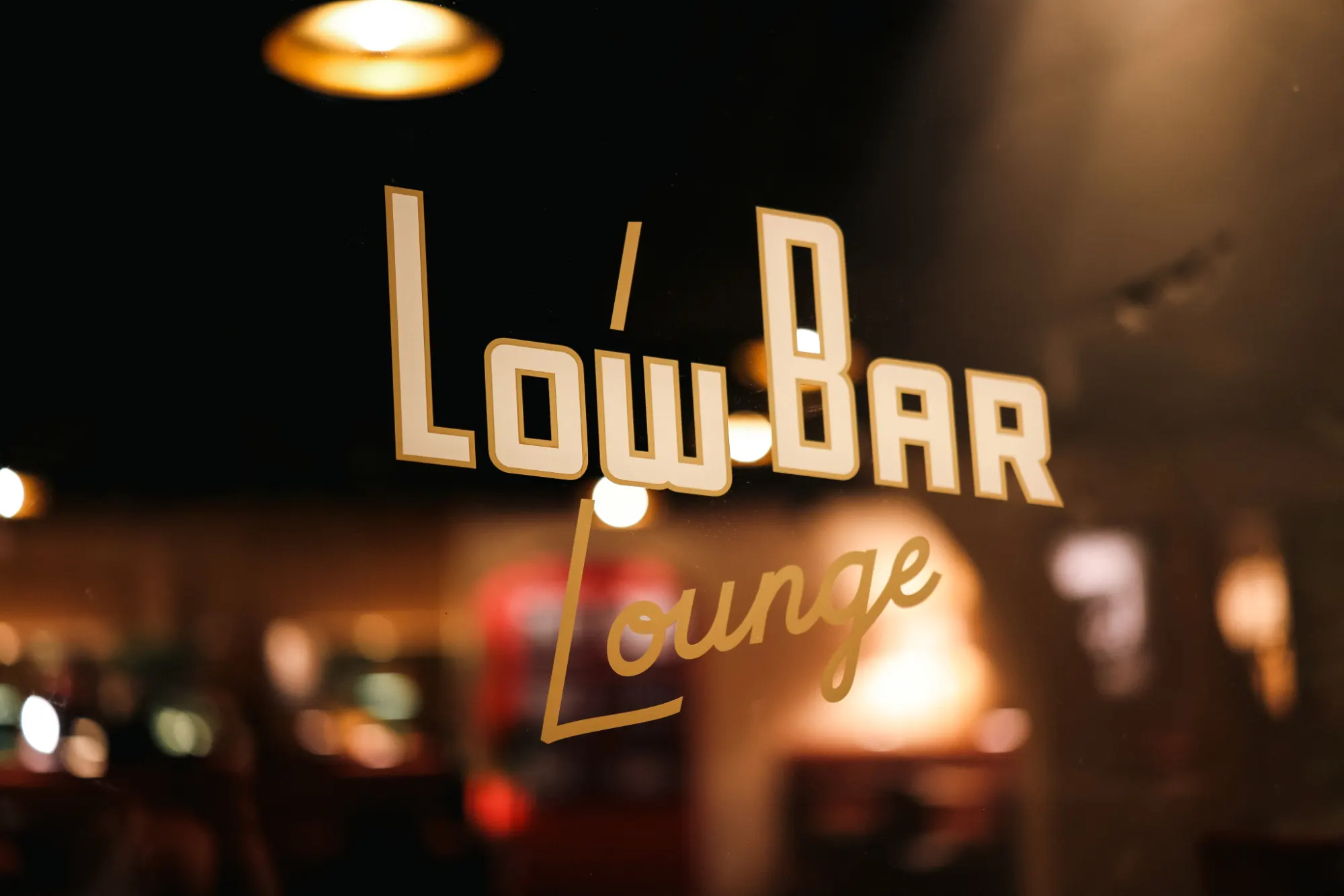 Low Bar Lounge signage on the front door's glass