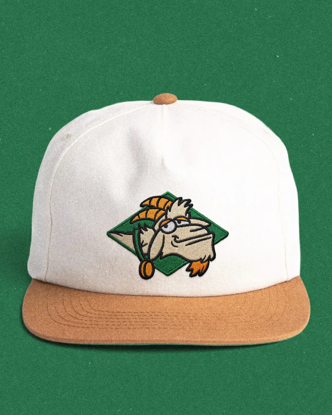 Bookie's mascot, Halftime, embroidered on a white and tan hat